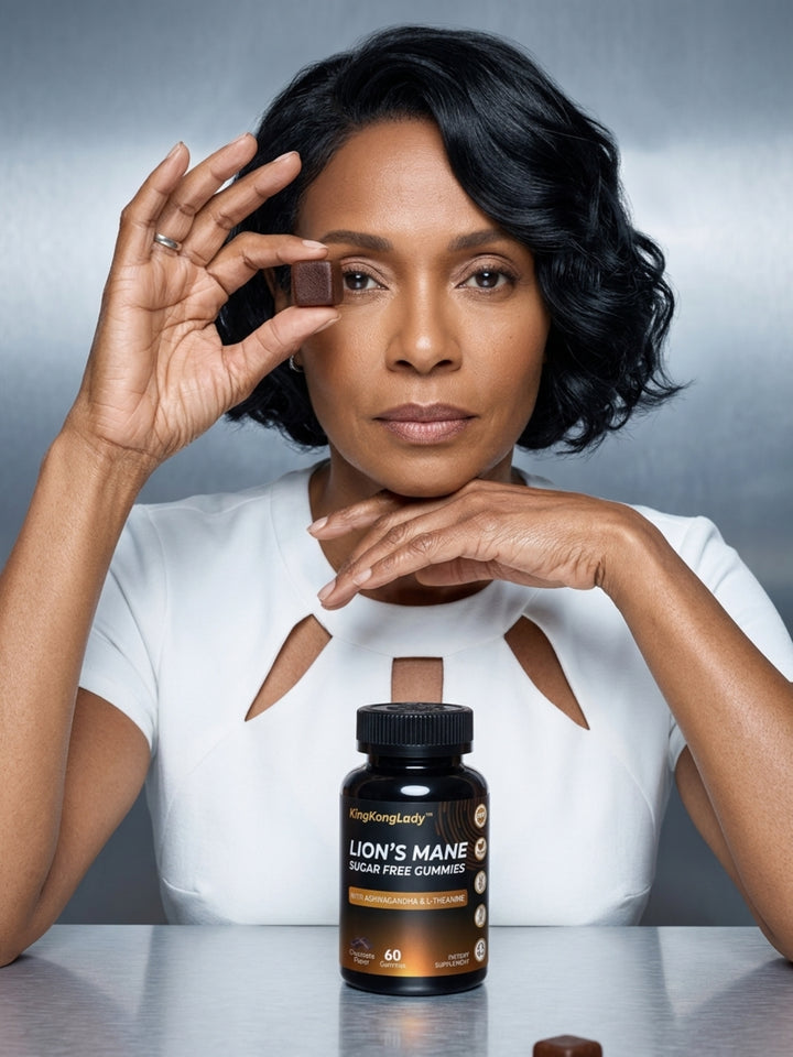 A woman holding a brown gummy beside a bottle of KingKongLady lion's mane gummies.